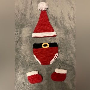 Newborn Santa Claus crochet/knitted outfit for photo shoots.